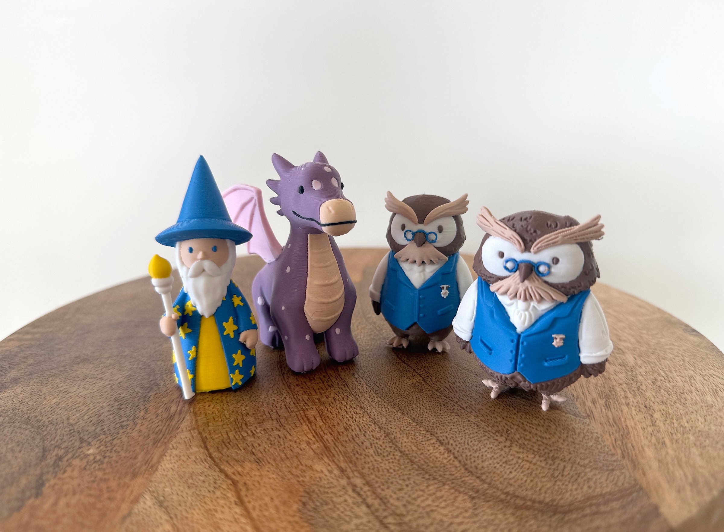 Three drawings in, three pawns out: the set as it stands, with the knight and the raccoon still to come.